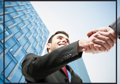 Handshake In Front Of a Commercial Building